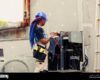 Competent mechanic starting routine condenser maintenance, assembling ...